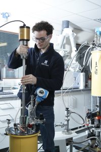 Dr Joey Walker inserting a probe into the EffecTech cryostat